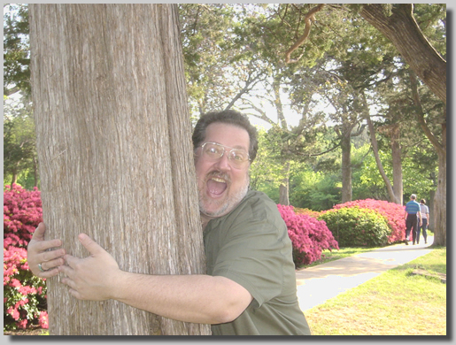 Dennis hugging a tree?