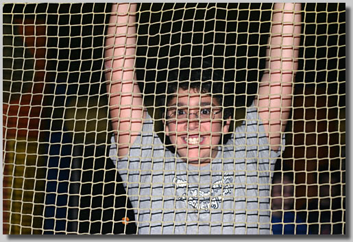This was a shot of Jonathan inside a big bouncy room that was in Huey's front lawn on New Year's Eve of 2004. He bounced away an instant after the shot was taken.