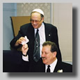 The men around the round table doin' bizness. Some bizarre ritual with a piece of cloth!