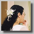 Rooty Jr. applying a few last minute beauty touches before the wedding in the bridal dressing room.