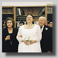 This is the wedding Processional with Rooty Jr. coming down the aisle with her parents on either side of her.