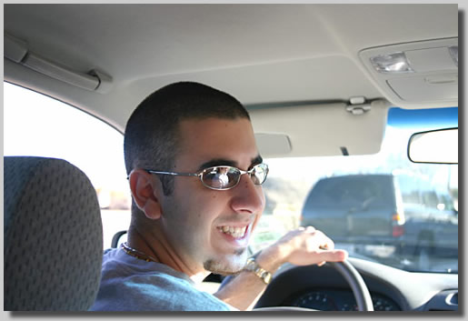Josh in the driver's seat of Sylvester (the name Ruthie has for her car). Oy! He looks like he has trouble in mind.