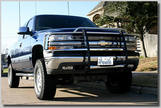 Josh's truck after some modifications he did to it. It was lifted, got a grill in front and back, new lights, an annoying megaphone, huge antennas and a few more items. Since this photo was taken he has lifted it once again and is waiting for some huge tires to lift it even more! I think he likes the truck.