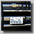 Josh's truck after some modifications he did to it. It was lifted, got a grill in front and back, new lights, an annoying megaphone, huge antennas and a few more items. Since this photo was taken he has lifted it once again and is waiting for some huge tires to lift it even more! I think he likes the truck.